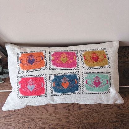 Irish Claddagh cushion featuring six colourful heart, hands and crown designs pop art style