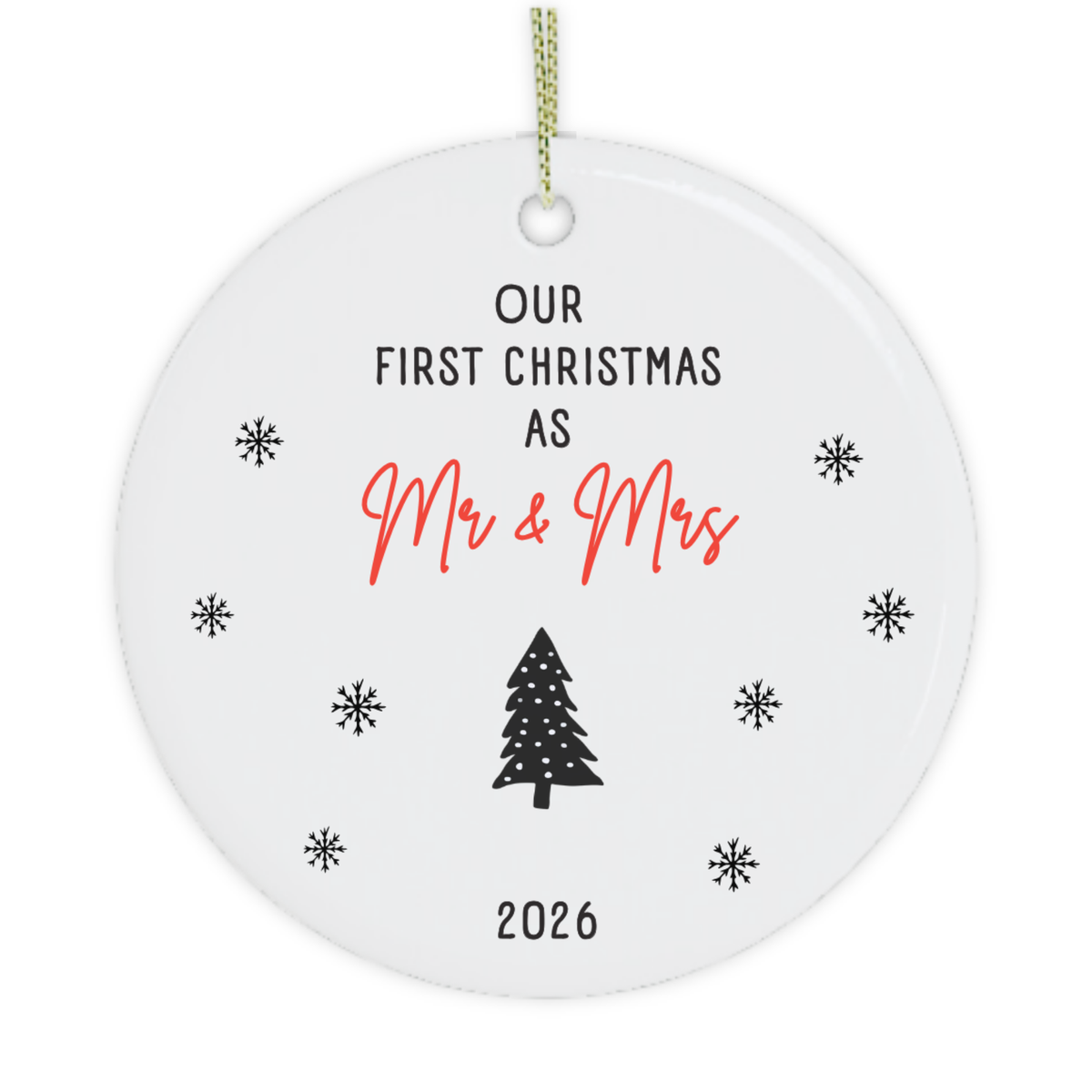 A round white ceramic Christmas ornament with a hanging loop, featuring the printed text 'OUR FIRST CHRISTMAS AS Mr & Mrs' in black and red, a black Christmas tree, and '2026' at the bottom, surrounded by small black snowflakes on a white background.