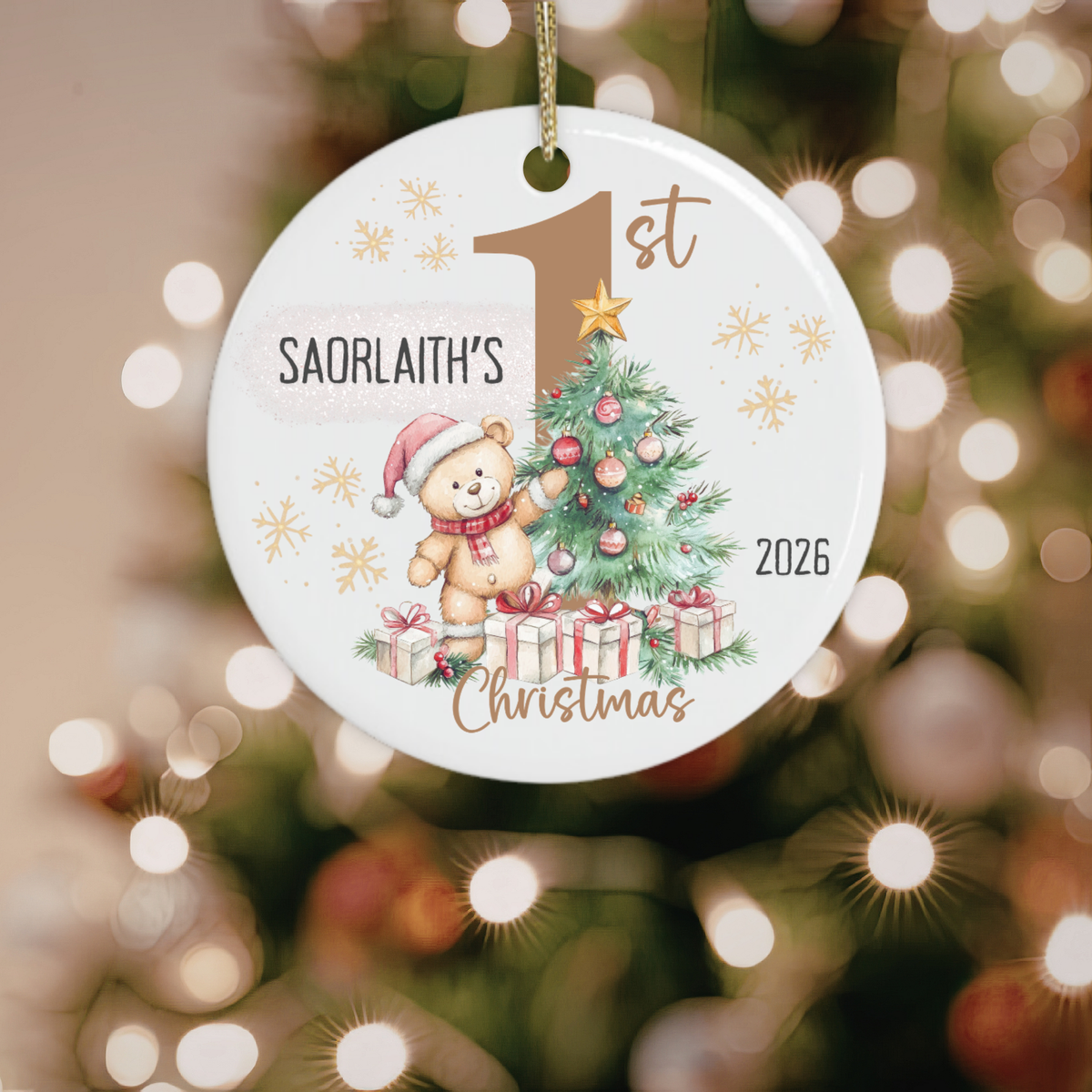 Personalised first Christmas ornament hanging on a Christmas tree