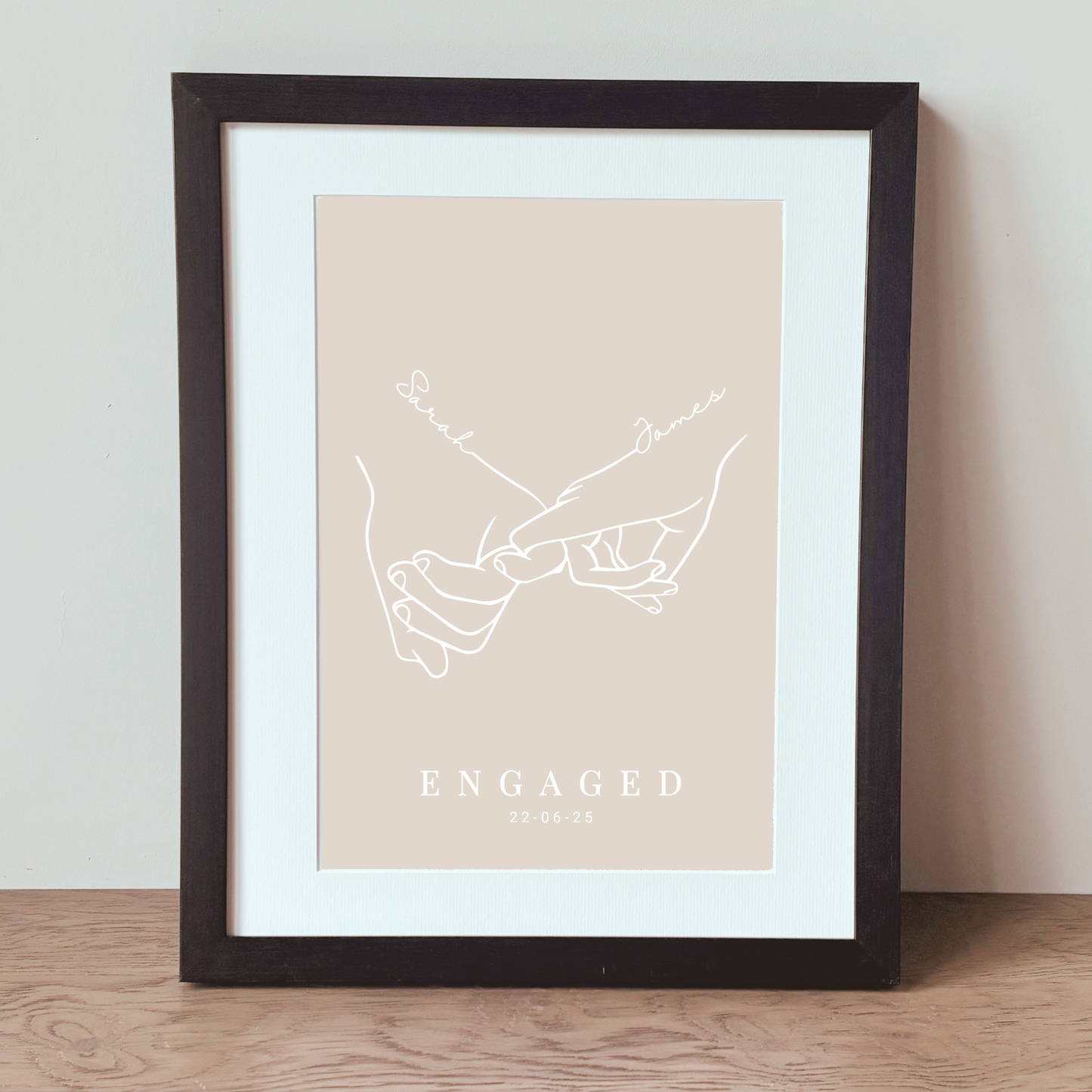 Framed personalised engagement gift featuring minimalist couple illustration
