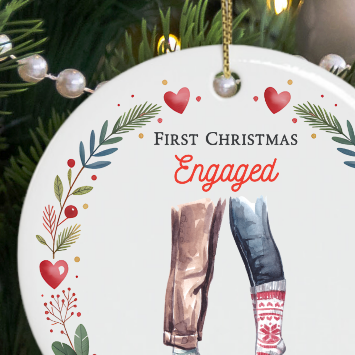 Close-up of the First Christmas Engaged ornament lettering and festive watercolour illustration