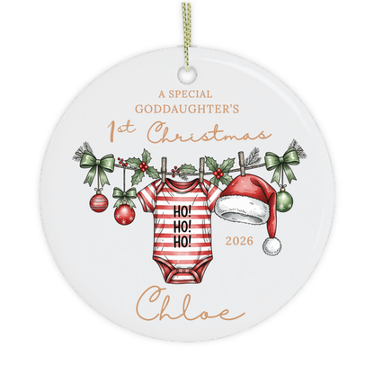 Close-up of personalised first Christmas ornament featuring a festive baby grow and baby's name.