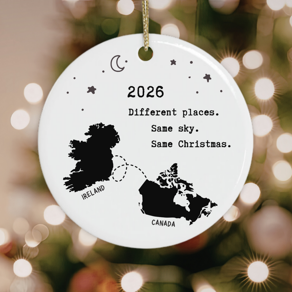 Ireland to Canada Christmas ornament with map silhouettes and “Different Places Same Sky Same Christmas”