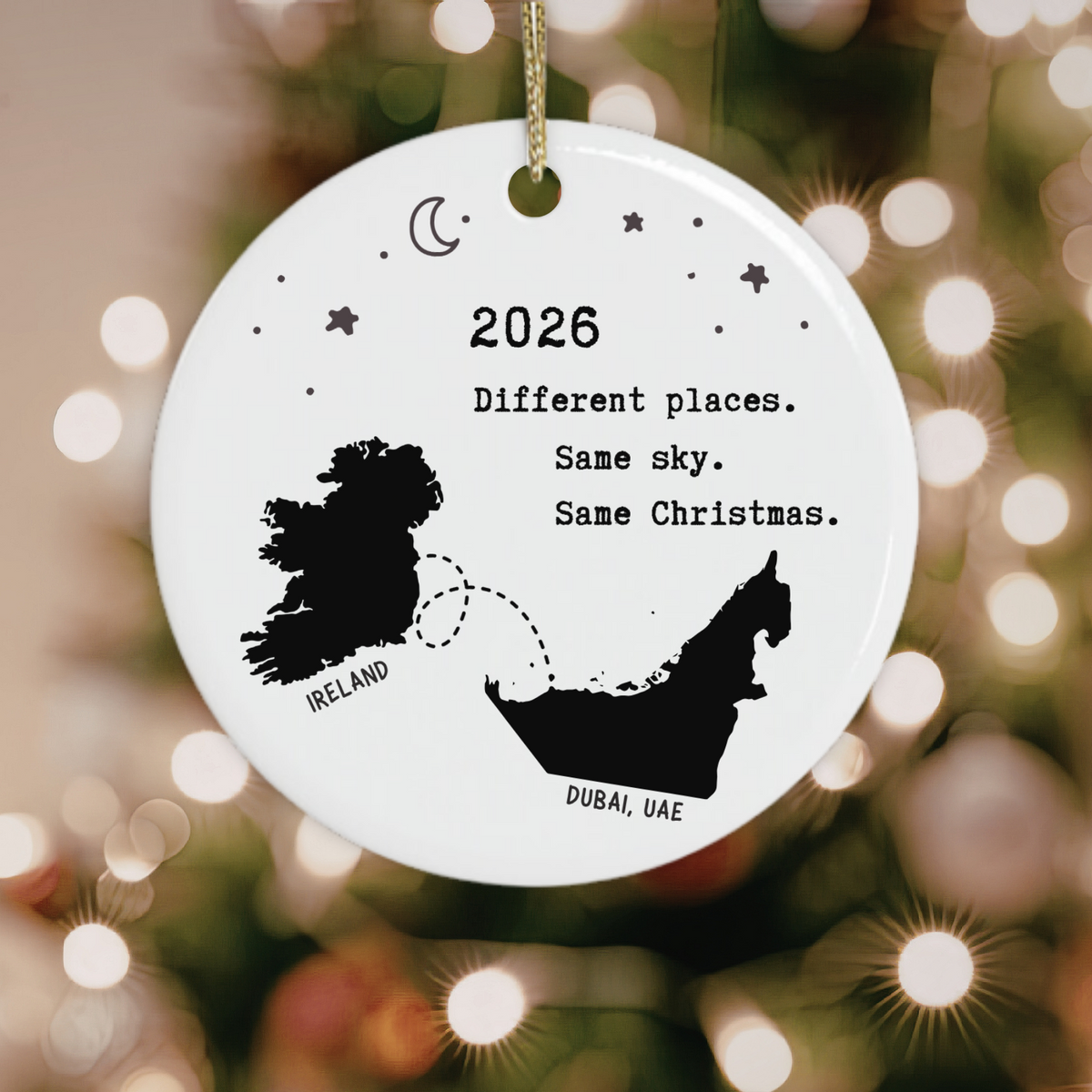 Ireland to Dubai Christmas ornament with map silhouettes and “Different Places Same Sky Same Christmas”