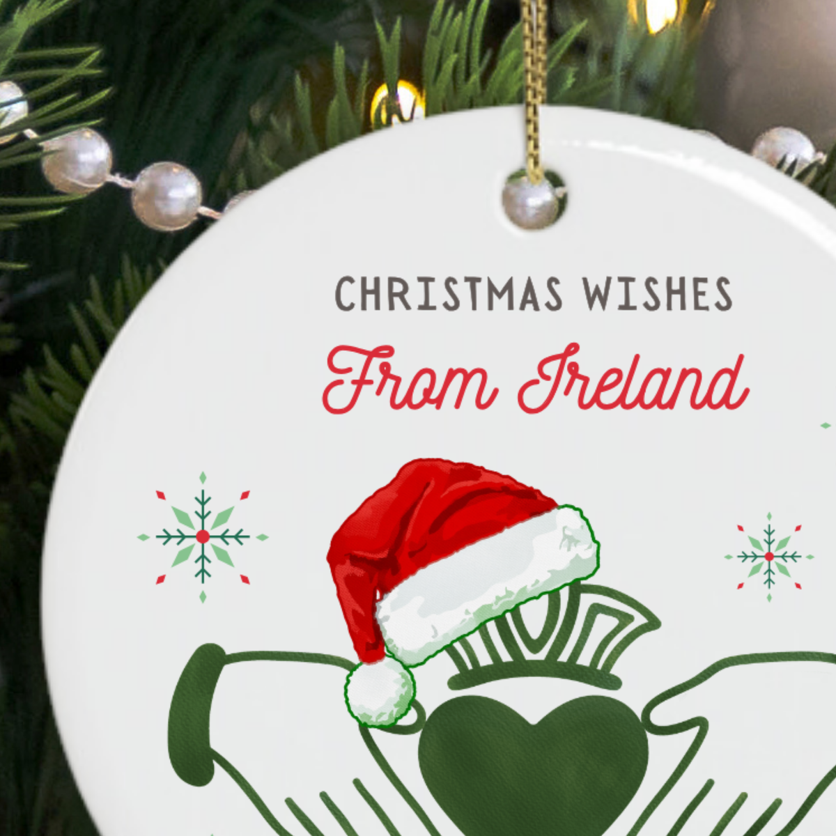 Close-up of the Claddagh symbol and festive details on an Irish Christmas ornament