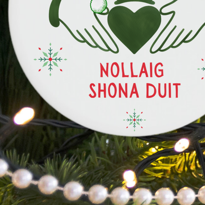 Close-up of the green Claddagh symbol and Santa hat on an Irish Christmas ornament