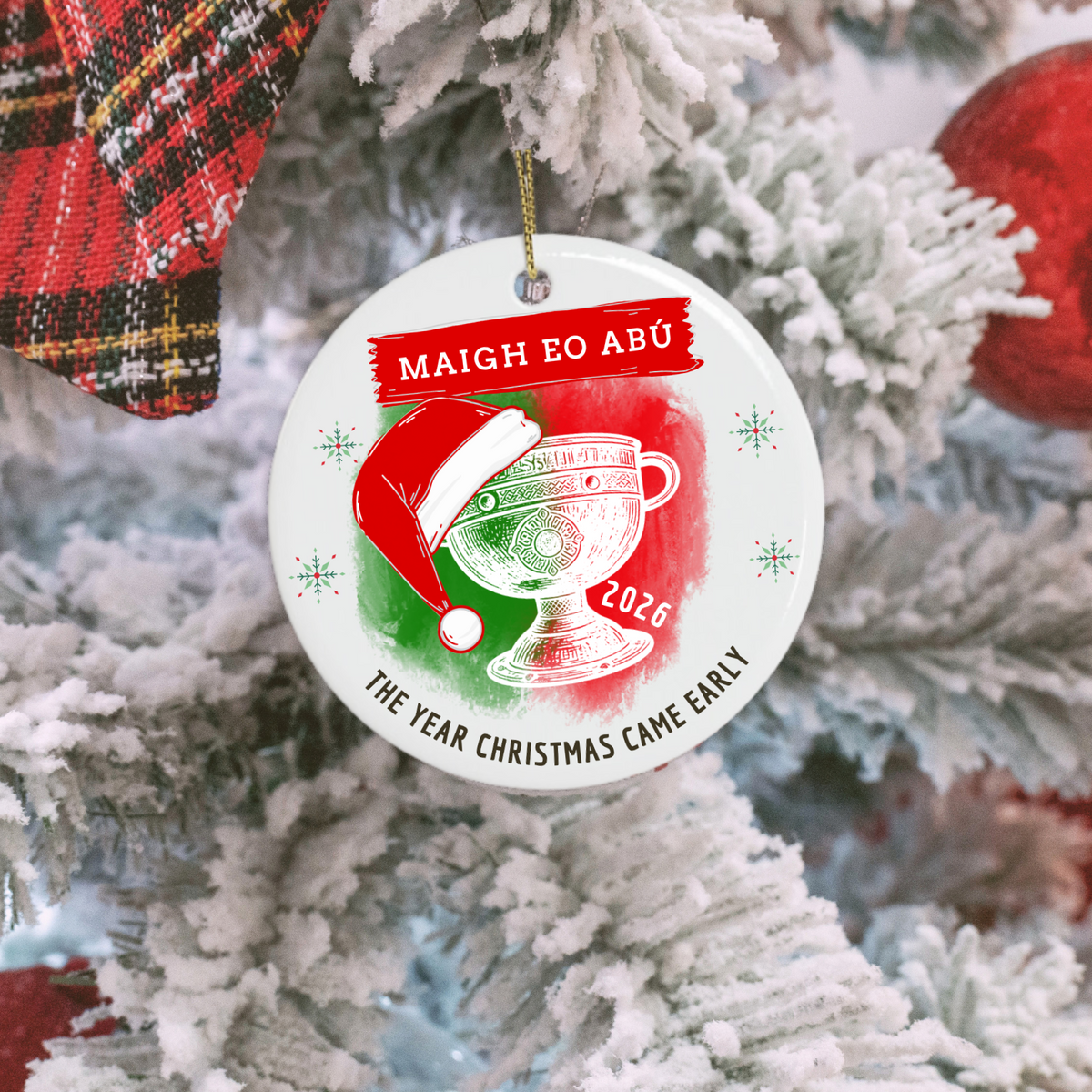 Mayo 2026 All-Ireland Christmas ornament featuring Maigh Eo Abú, Sam Maguire Cup and festive Santa hat on a frosted tree