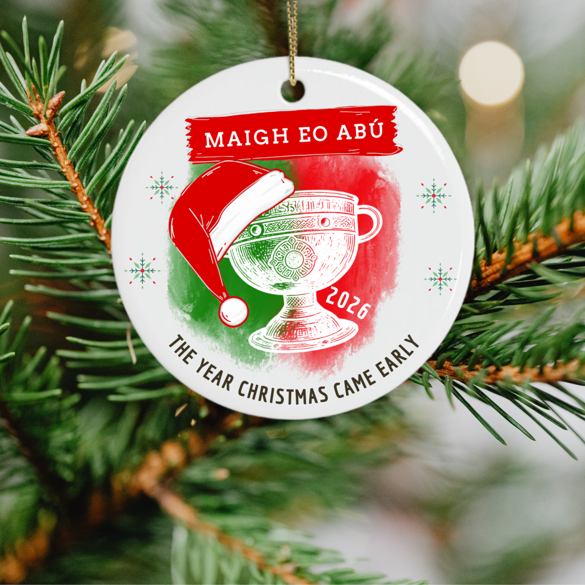 Mayo 2026 All-Ireland Christmas ornament featuring Maigh Eo Abú, Sam Maguire Cup and festive Santa hat hanging on a christmas tree