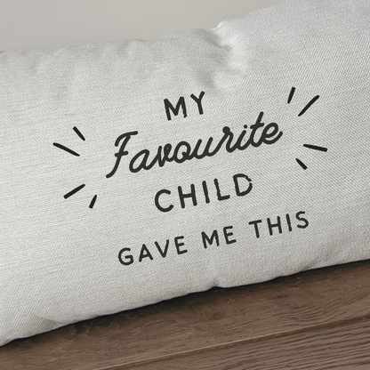Funny parent cushion reading “My Favourite Child Bought Me This” on natural linen-style fabric