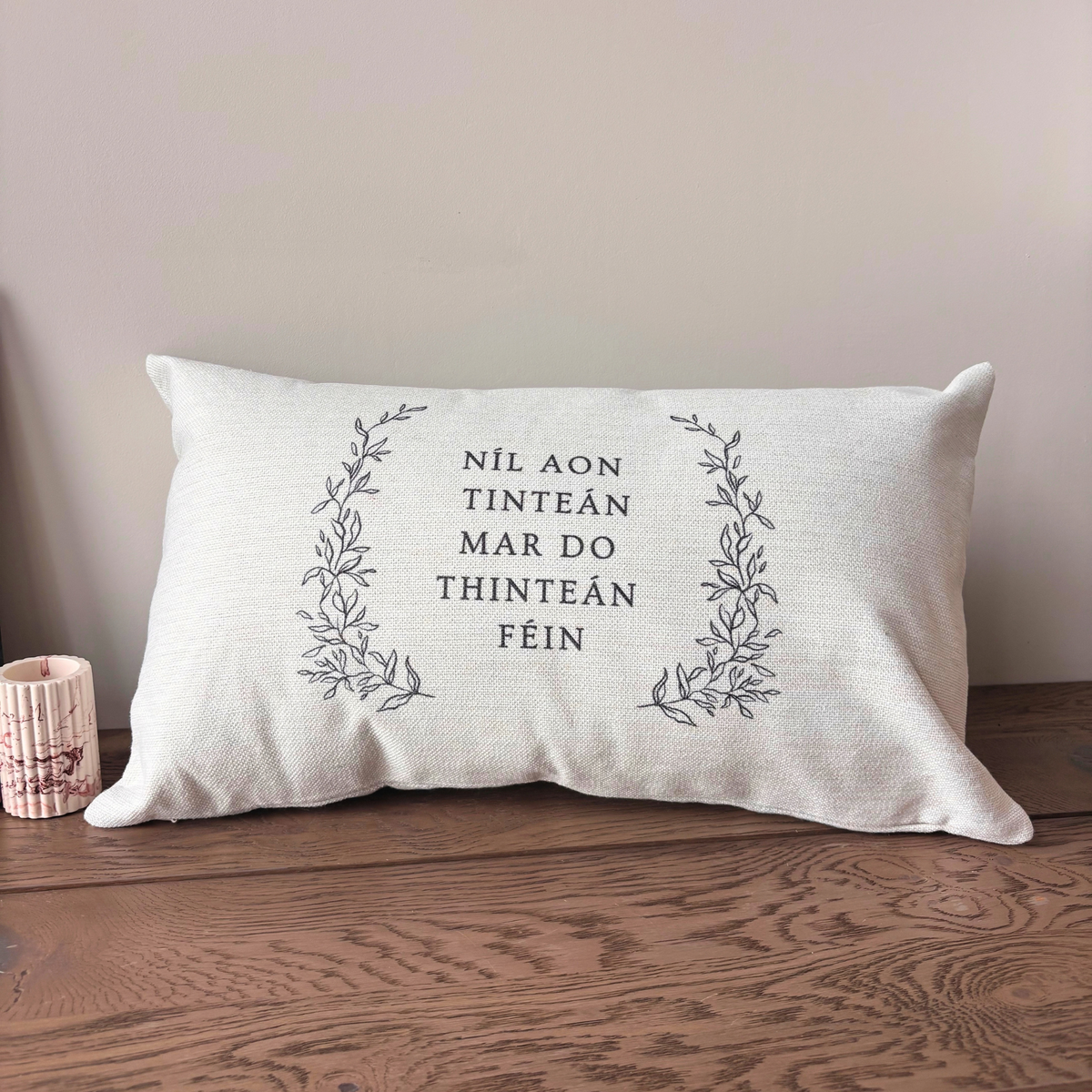 Níl Aon Tinteán Irish quote cushion with botanical design by Willow & Moon