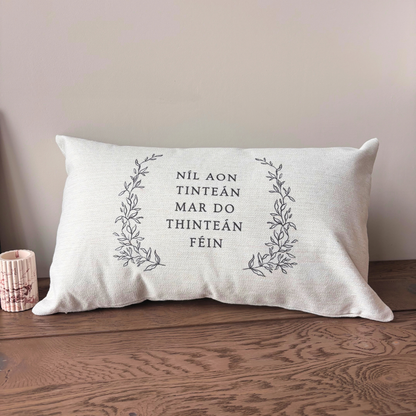Níl Aon Tinteán Irish quote cushion with botanical design by Willow & Moon