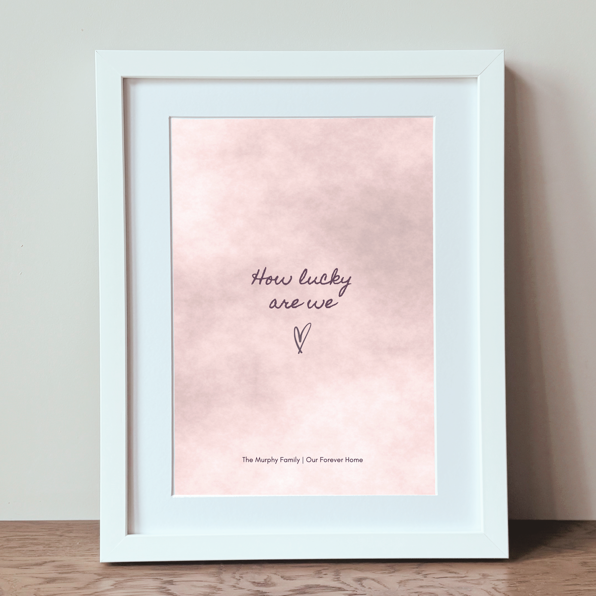 Personalised How Lucky Are We blush print in a white frame
