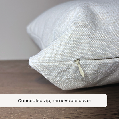 textured-linen-cushion-irish-keepsake-closeup-zip-detail and removable cover on a wooden surface.