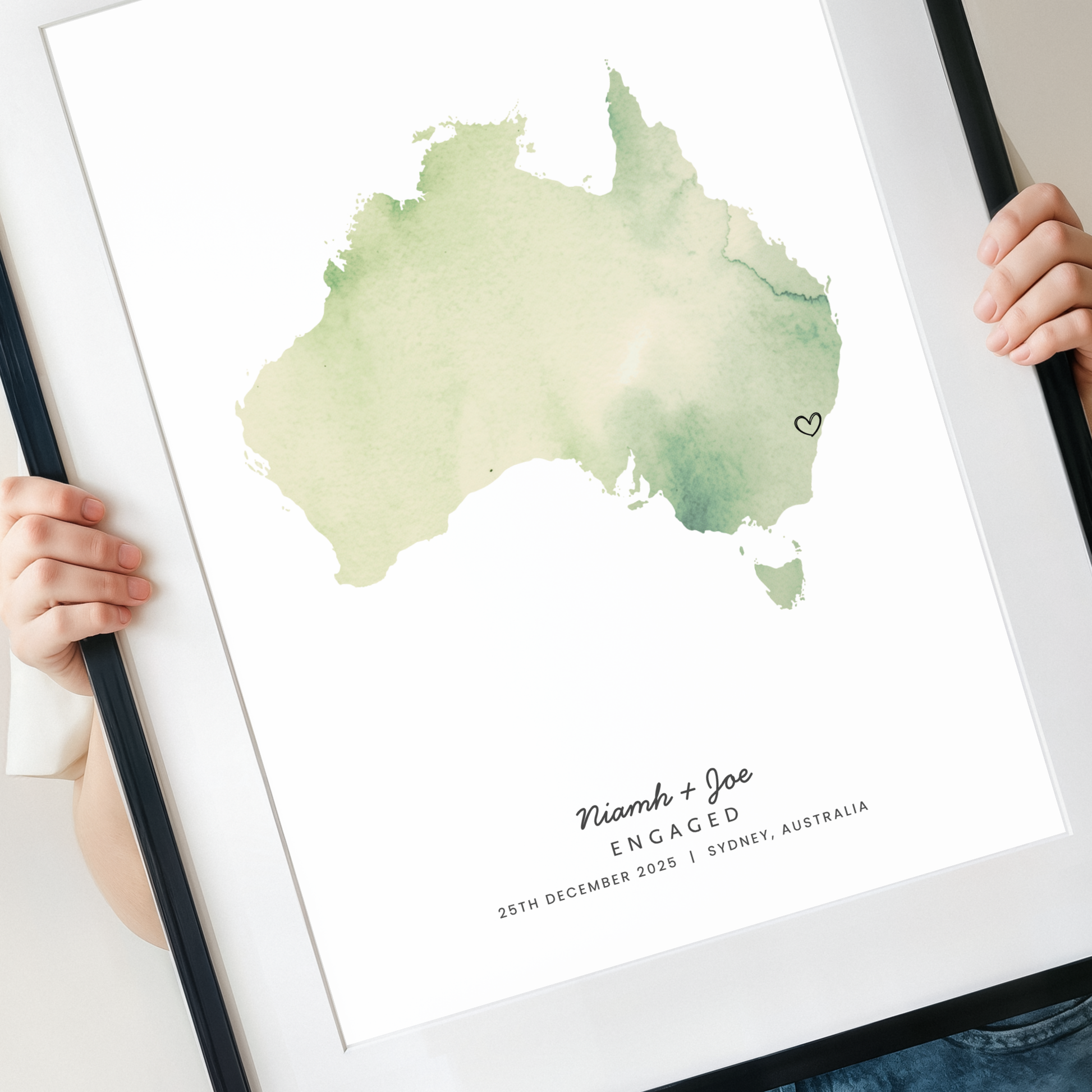 woman holding  Personalised Australia engagement map print with names and proposal date